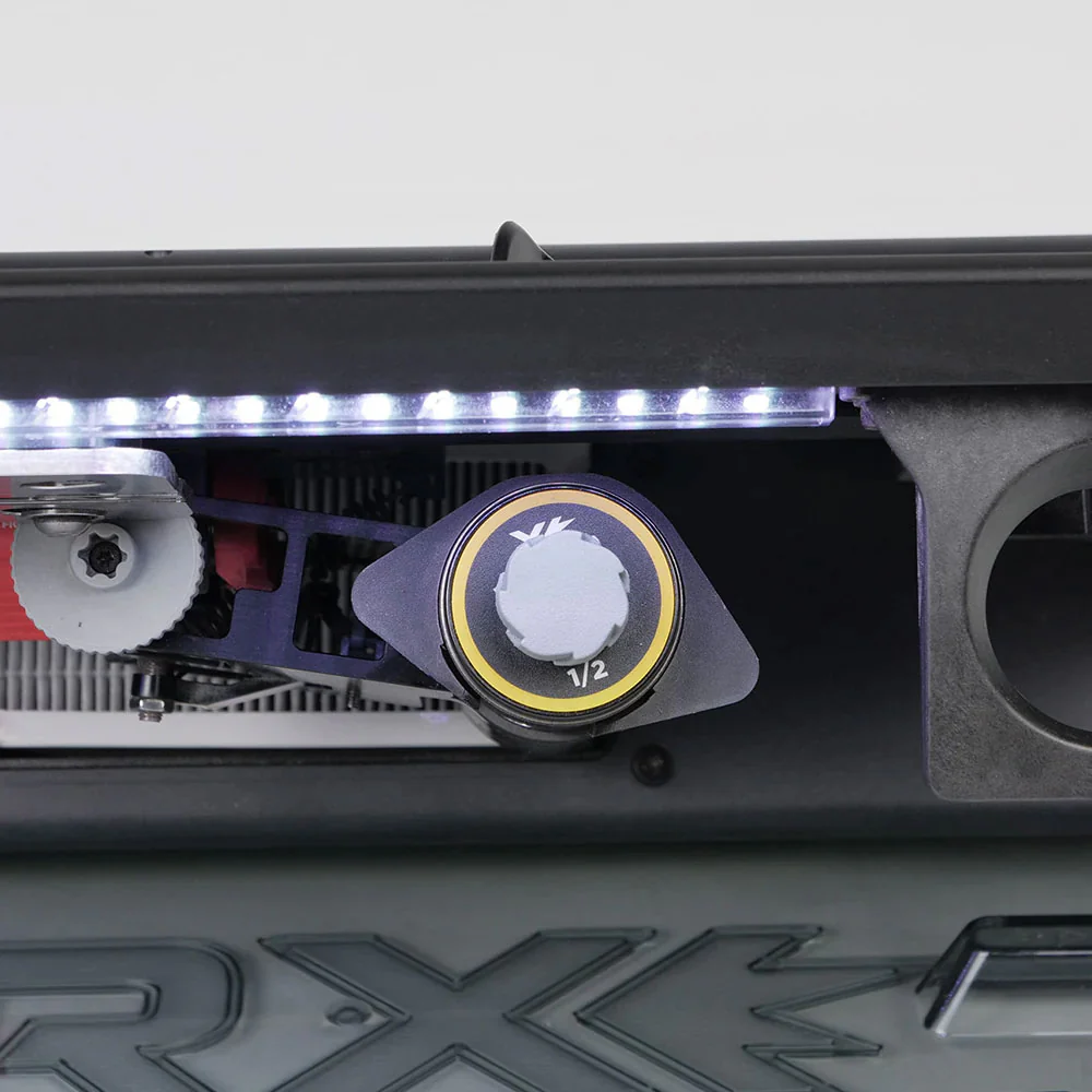 Close-up of the SPARX 3 sharpener — LED strip lit, a 1/2-inch grinding ring loaded